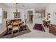 Elegant dining area featuring tile floors, an elegant chandelier, and stylish Asian-inspired decor at 4123 Cascade Falls Dr, Sarasota, FL 34243
