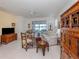 Bright living room with tile flooring, sliding glass doors to the lanai, and stylish Asian-inspired decor at 4123 Cascade Falls Dr, Sarasota, FL 34243