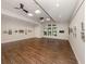 Large meeting room boasts wood floors, ceiling fans, and windows providing natural light at 4123 Cascade Falls Dr, Sarasota, FL 34243
