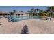 Large community pool with lap lane and a building with lounge chairs surrounding at 4123 Cascade Falls Dr, Sarasota, FL 34243