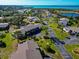This aerial view shows the community's layout with lush greenery, landscaping, and winding roads at 4260 Placida Rd # 25D, Englewood, FL 34224