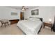 Well-lit bedroom with furniture, ceiling fan, and carpeted floor at 4260 Placida Rd # 25D, Englewood, FL 34224