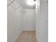 Walk-in closet with white walls and carpet flooring at 4260 Placida Rd # 25D, Englewood, FL 34224