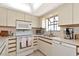 Efficient kitchen featuring modern appliances, spacious countertops, and functional layout for easy cooking at 4260 Placida Rd # 25D, Englewood, FL 34224