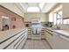 Well-maintained kitchen with ample counter space, white cabinetry, and essential appliances included at 4260 Placida Rd # 25D, Englewood, FL 34224