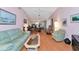 Spacious living area with ample seating, beautiful decor, and seamless flow into the dining and kitchen at 4260 Placida Rd # 25D, Englewood, FL 34224