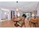 Open living and dining area with laminate flooring and plenty of natural light at 4260 Placida Rd # 25D, Englewood, FL 34224