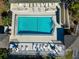 Aerial view of a large, rectangular pool with lounge chairs surrounding the pool at 4260 Placida Rd # 25D, Englewood, FL 34224