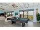 Recreation room with a pool table, lounge furniture, and natural lighting at 4260 Placida Rd # 25D, Englewood, FL 34224