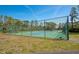 The community offers a well-maintained tennis court surrounded by lush greenery and a secure fence at 4260 Placida Rd # 25D, Englewood, FL 34224