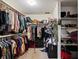 Organized walk-in closet featuring ample storage with shelving and hanging racks for clothes and accessories at 427 Canterbury Rd, Venice, FL 34293