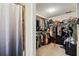 Walk-in closet with ample storage and a shower with rod and curtain at 427 Canterbury Rd, Venice, FL 34293