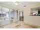 Cozy sun room featuring tile floors and an open view of the dining area at 427 Canterbury Rd, Venice, FL 34293