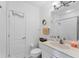 Clean bathroom with a vanity sink, toilet, and shower at 4433 Corso Venetia Blvd # C18, Venice, FL 34293