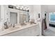 Spacious bathroom with double sinks, ample lighting, and a large mirror at 4433 Corso Venetia Blvd # C18, Venice, FL 34293