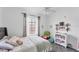 Bright bedroom featuring a ceiling fan, natural light and plush carpeting at 4433 Corso Venetia Blvd # C18, Venice, FL 34293