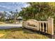 Community entrance sign with lush landscaping and a waterfall feature at 4433 Corso Venetia Blvd # C18, Venice, FL 34293