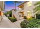 Charming exterior view of a multi-level condo complex showcasing lush landscaping and inviting entrance stairs at 4433 Corso Venetia Blvd # C18, Venice, FL 34293