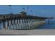 Fishing pier extending over the water, perfect for outdoor recreation and scenic views at 4433 Corso Venetia Blvd # C18, Venice, FL 34293
