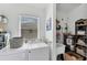 Functional laundry room featuring a washer, dryer, and storage shelves at 4433 Corso Venetia Blvd # C18, Venice, FL 34293