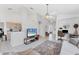 Open concept living area with tile flooring, modern decor, and seamless flow to the kitchen and dining spaces at 4433 Corso Venetia Blvd # C18, Venice, FL 34293