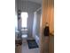 Bathroom with toilet, shower, and patterned wallpaper at 457 Longwood Dr, Venice, FL 34285
