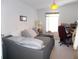 Cozy bedroom with comfortable bed and ample natural light creating a serene retreat at 457 Longwood Dr, Venice, FL 34285