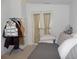 Cozy bedroom with carpet and double french doors, perfect for relaxation and quiet retreat at 457 Longwood Dr, Venice, FL 34285