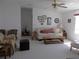 Bright living room with neutral carpet and stylish decor offers a cozy gathering space at 457 Longwood Dr, Venice, FL 34285