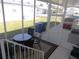 Enclosed patio with outdoor seating and views of the community at 457 Longwood Dr, Venice, FL 34285