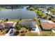 Aerial shot showcasing the home's proximity to the tranquil waters and the waterfront neighborhood at 4740 Payne St, North Port, FL 34287