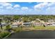 Beautiful waterfront home with backyard access to the lake, surrounded by lush landscaping at 4740 Payne St, North Port, FL 34287