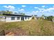 Large backyard with an expansive lawn, providing ample space for outdoor activities and entertainment at 4740 Payne St, North Port, FL 34287