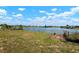 Backyard featuring a chain-link fence providing a secure border and waterfront view at 4740 Payne St, North Port, FL 34287