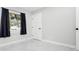 Bright bedroom with a window providing ample light, complimented by tiled flooring and neutral paint at 4740 Payne St, North Port, FL 34287