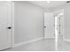 View of bedroom featuring sleek tiled flooring and modern doors and trim at 4740 Payne St, North Port, FL 34287