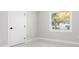 Bedroom with window providing natural light, neutral walls and tiled flooring at 4740 Payne St, North Port, FL 34287