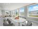 Large light filled dining room with marble floors and water view at 4740 Payne St, North Port, FL 34287