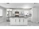 Modern kitchen with white cabinets, stainless steel appliances and island at 4740 Payne St, North Port, FL 34287