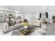 Spacious living area featuring an open-concept design, connecting the living room, kitchen, and dining area at 4740 Payne St, North Port, FL 34287