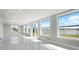 Bright living room featuring many windows offering an abundance of natural light and scenic lake views at 4740 Payne St, North Port, FL 34287