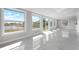 Sun filled living room with large windows and water views at 4740 Payne St, North Port, FL 34287