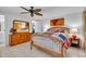 Relaxing bedroom featuring a wooden bed frame, mirrored dresser, and neutral colors at 491 Conrad Rd, Venice, FL 34293