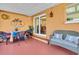 Covered patio with outdoor seating, perfect for relaxing and entertaining at 491 Conrad Rd, Venice, FL 34293