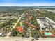 Scenic aerial view showcasing community with a tennis court, pools, ponds and lush landscaping at 503 Pine Hollow Cir # 503, Englewood, FL 34223