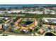 Aerial view of villas with a heart shaped pond surrounded by lush greenery and landscaping at 503 Pine Hollow Cir # 503, Englewood, FL 34223