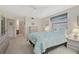 Bedroom with a large bed, ceiling fan and easy access to the bathroom and closet at 503 Pine Hollow Cir # 503, Englewood, FL 34223