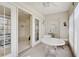 Bright Florida room with white wicker furniture, offering a great space to relax and enjoy the view at 503 Pine Hollow Cir # 503, Englewood, FL 34223