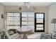Florida room featuring a ceiling fan, large windows, and a table and chairs at 503 Pine Hollow Cir # 503, Englewood, FL 34223