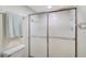 Bathroom shower with a frosted sliding glass door and a towel bar at 503 Pine Hollow Cir # 503, Englewood, FL 34223